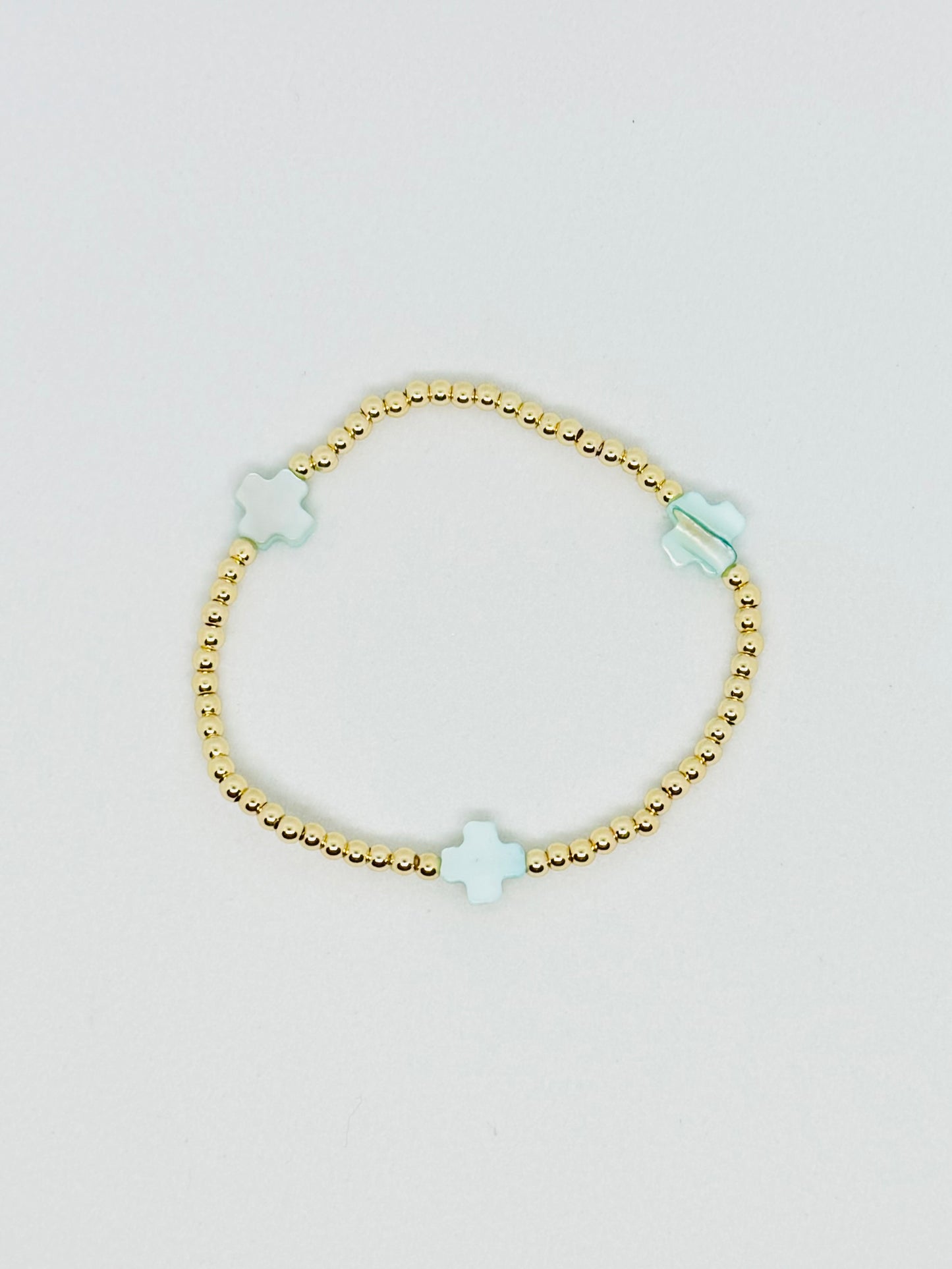 H L M Gold Beaded Cross Bracelet