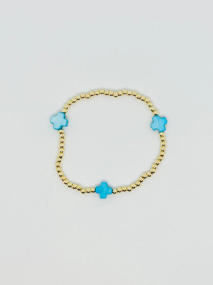 H L M Gold Beaded Cross Bracelet